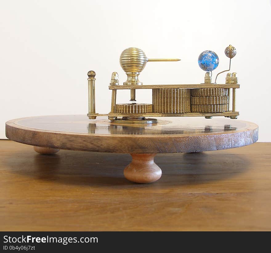 Orrery Ferguson's paradox Machine Model. Showing the orbits of the earth and moon when you manually turn the model by the front brass shaft. My husband made this model.