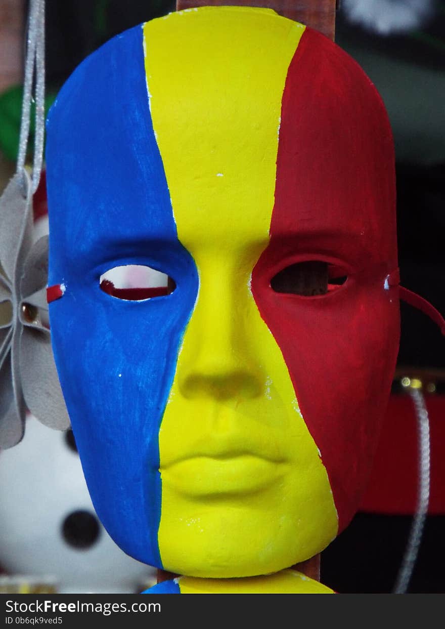 Picture with romanian mask painted in blue yellow and red. Picture with romanian mask painted in blue yellow and red