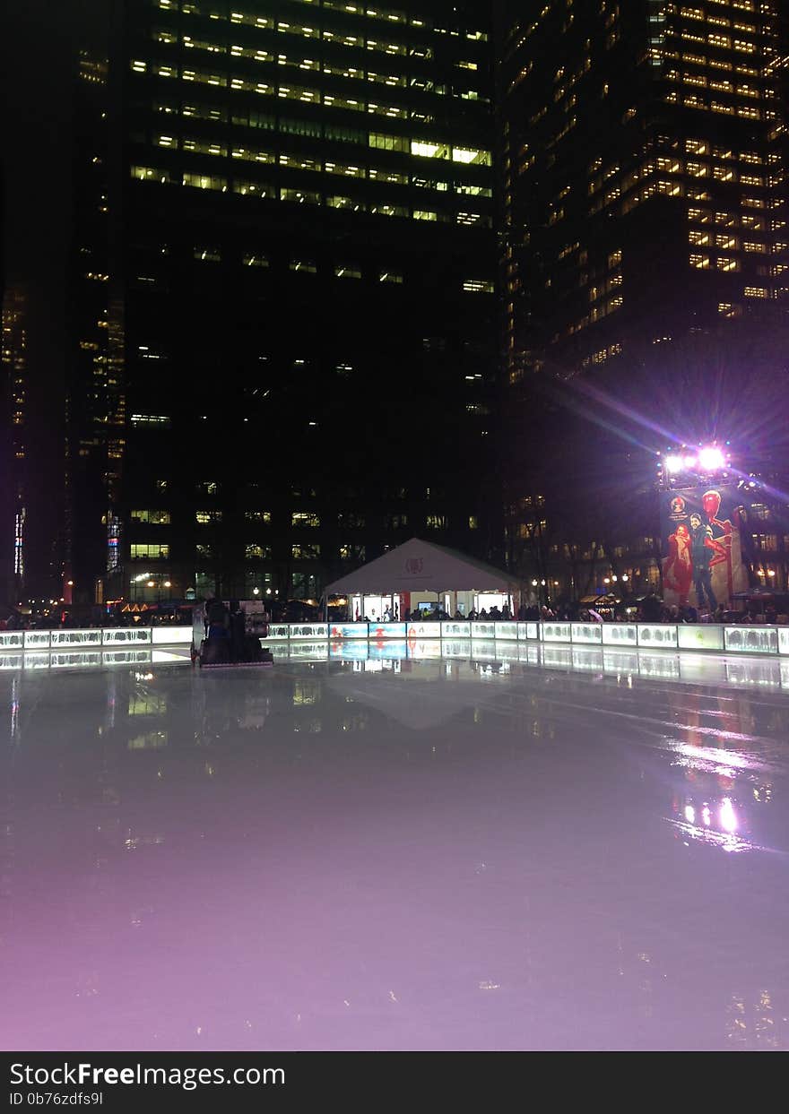 Ice Skating Rink at Bryant Park in the Evening in Manhattan, New York, NY. Ice Skating Rink at Bryant Park in the Evening in Manhattan, New York, NY.