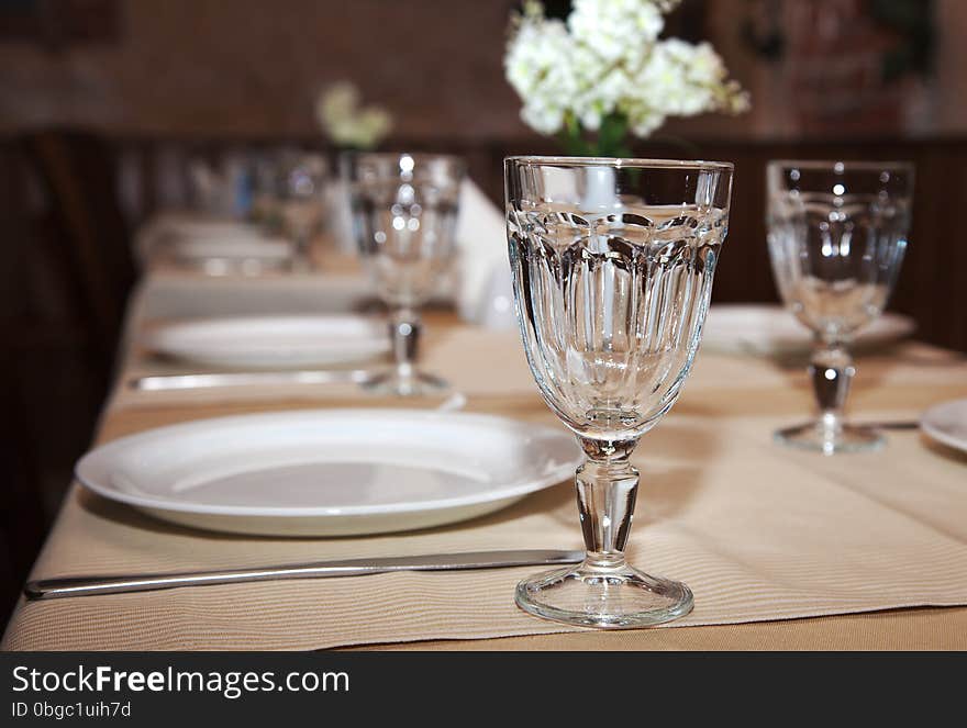 Glasses and plates on table