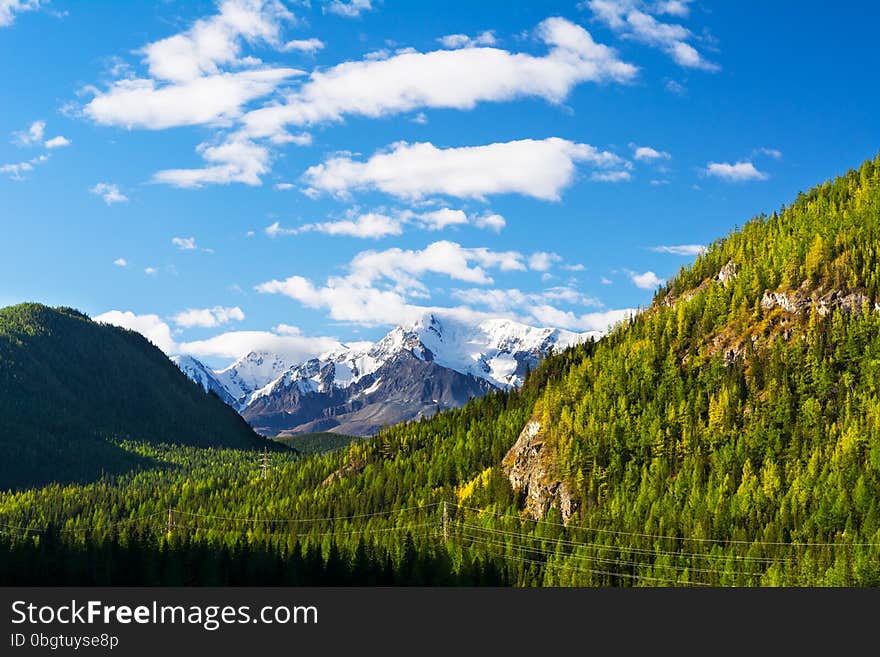 Summer mountains snow-capped peaks