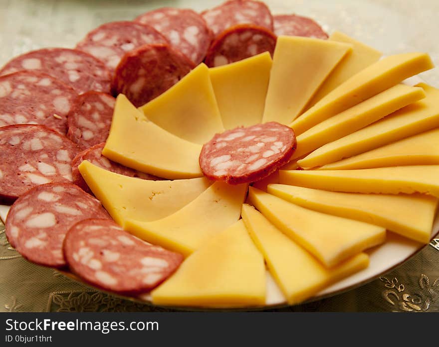 Slices Of Sausage And Cheese On A Plate