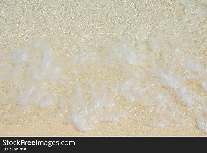 White Foam Made By Ocean Waves