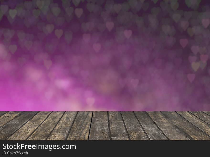 Wooden deck table with foliage bokeh background.Template mock up for display of your product