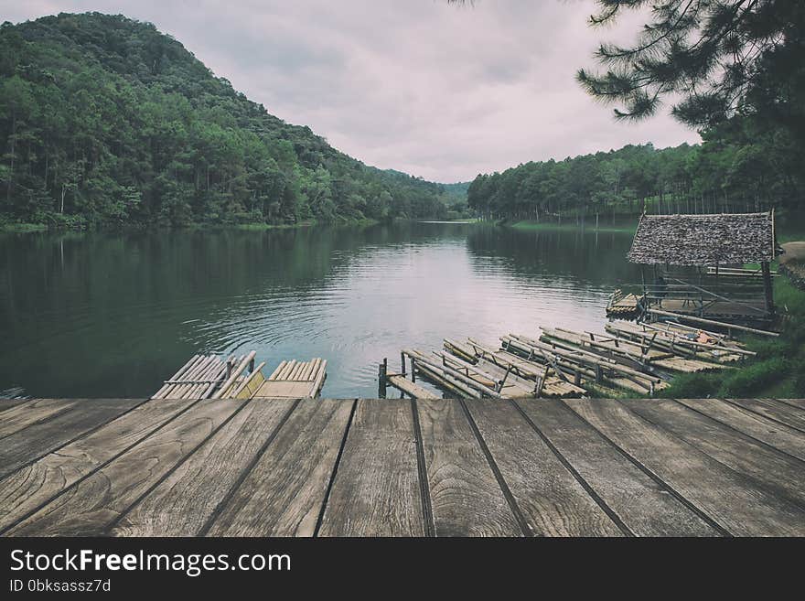 Wooden floor with lake landscape. vintage stylization