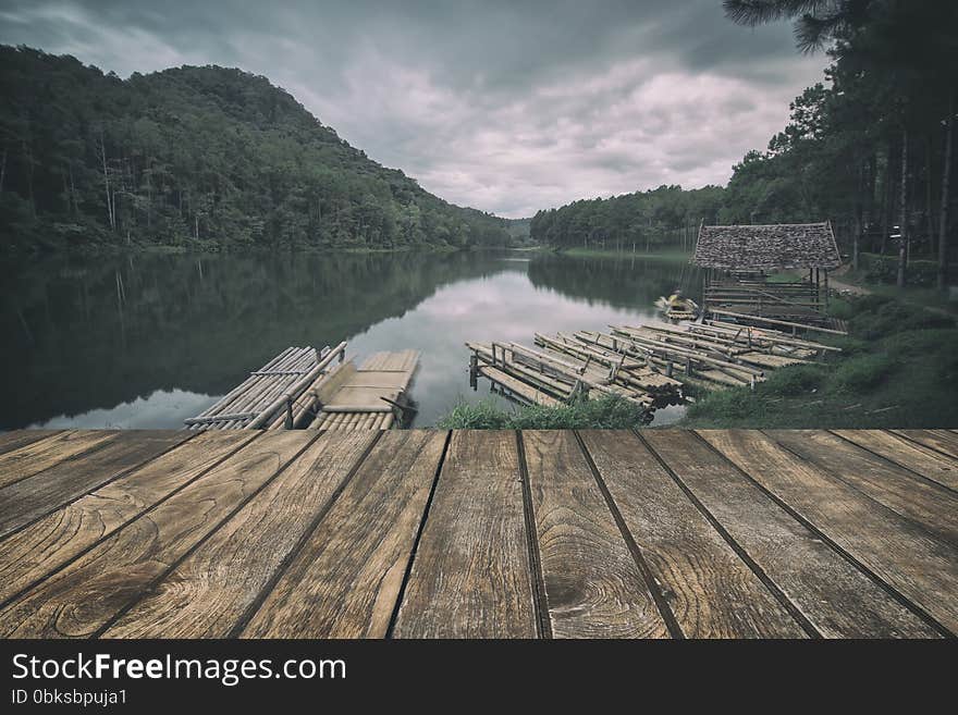 Wooden floor with lake landscape. vintage stylization