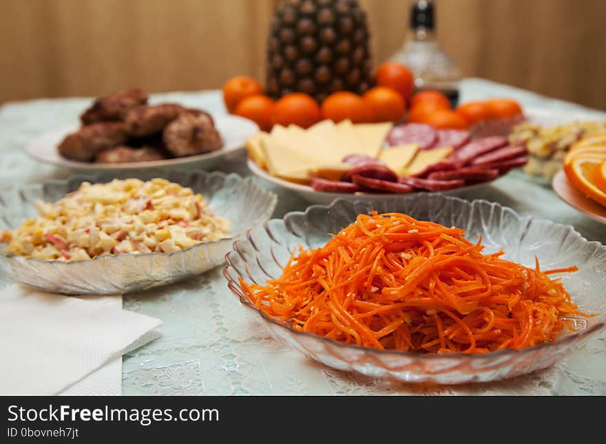 Carrot salad on a plate on the festive table