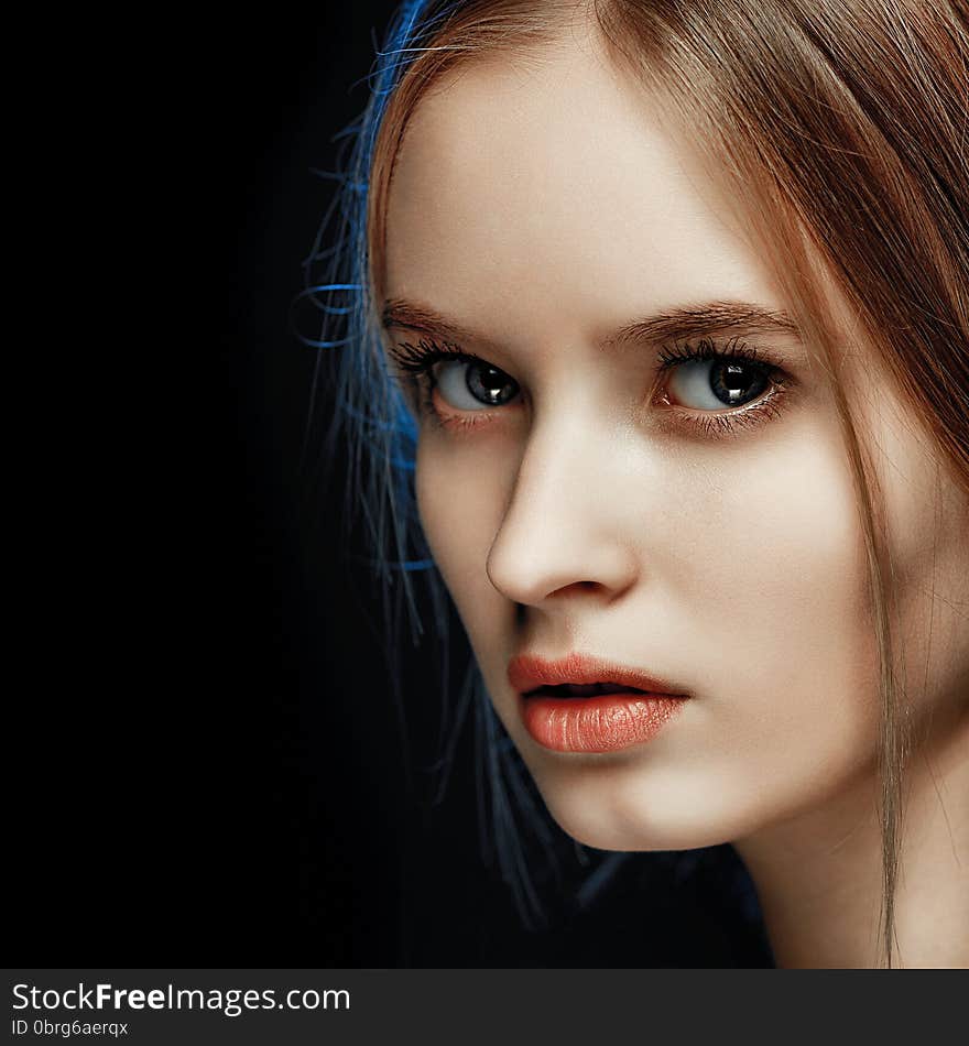 Beauty model with perfect long glossy brown hair. Close-up portrait.