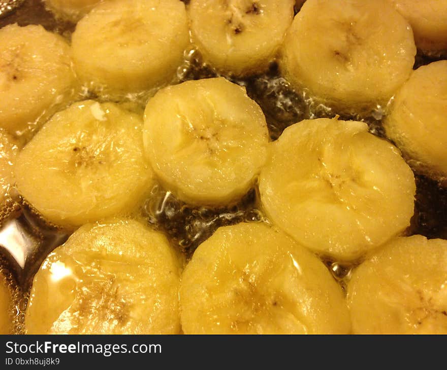 Sliced Bananas Being Fried in Oil.