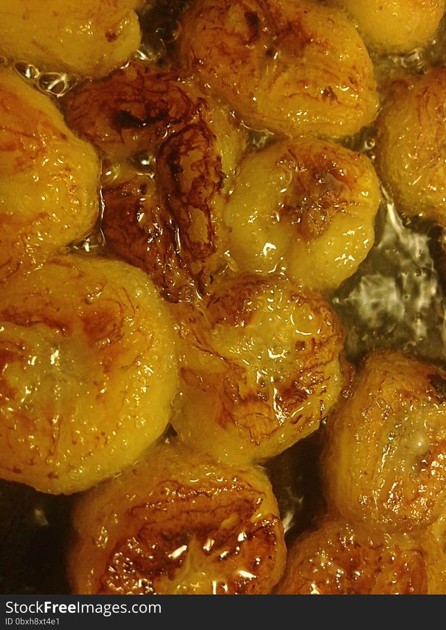 Sliced Bananas Being Fried in Oil.