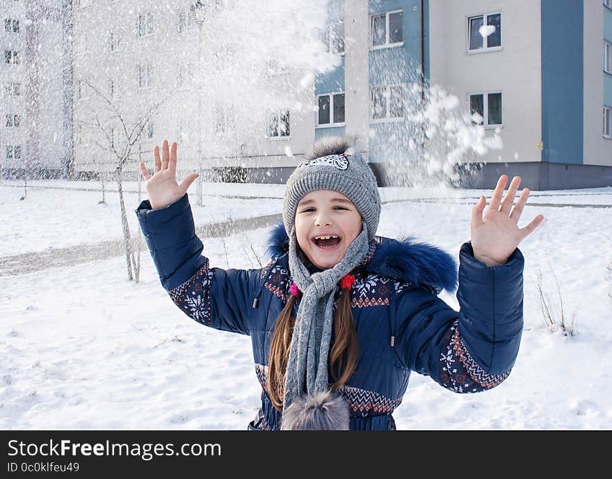 Girl playing in the snow