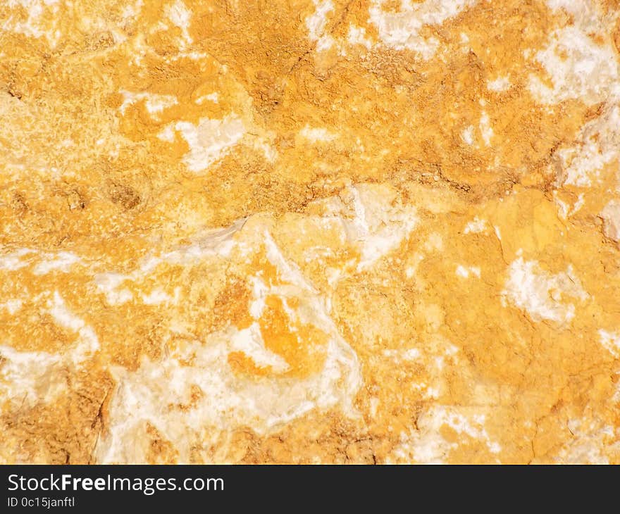 Orange colored textured water rock