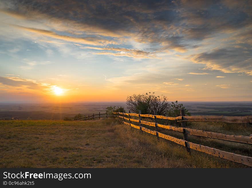 Meadow with wooden fence