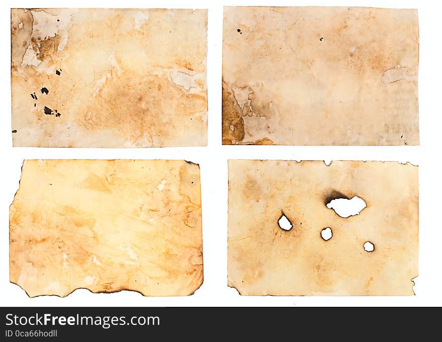 Old paper with dirty stains, the burnt edges on white background. Old paper with dirty stains, the burnt edges on white background