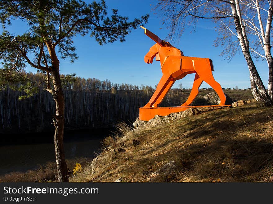 Orange moose on the river Bank in Russia in the Urals