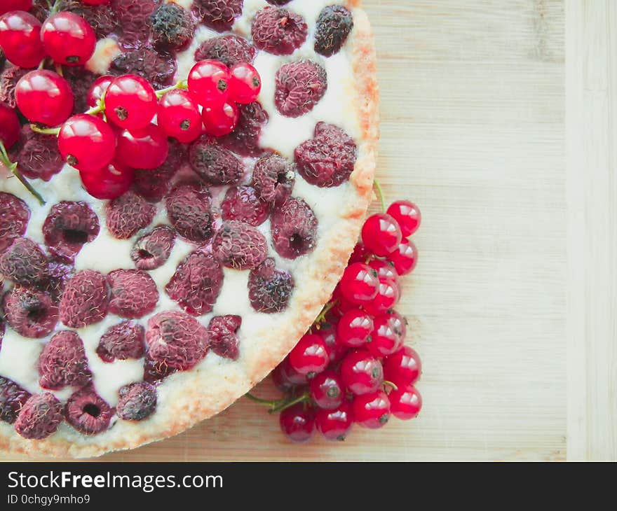 Cake with raspberries topped with fresh red currants. Cake with raspberries topped with fresh red currants