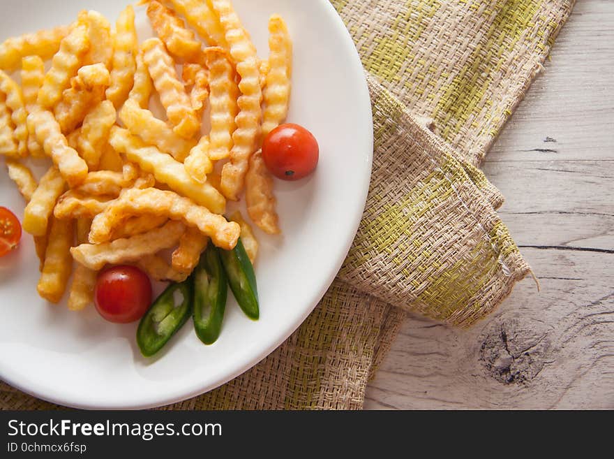 French Fries On Wooden Background