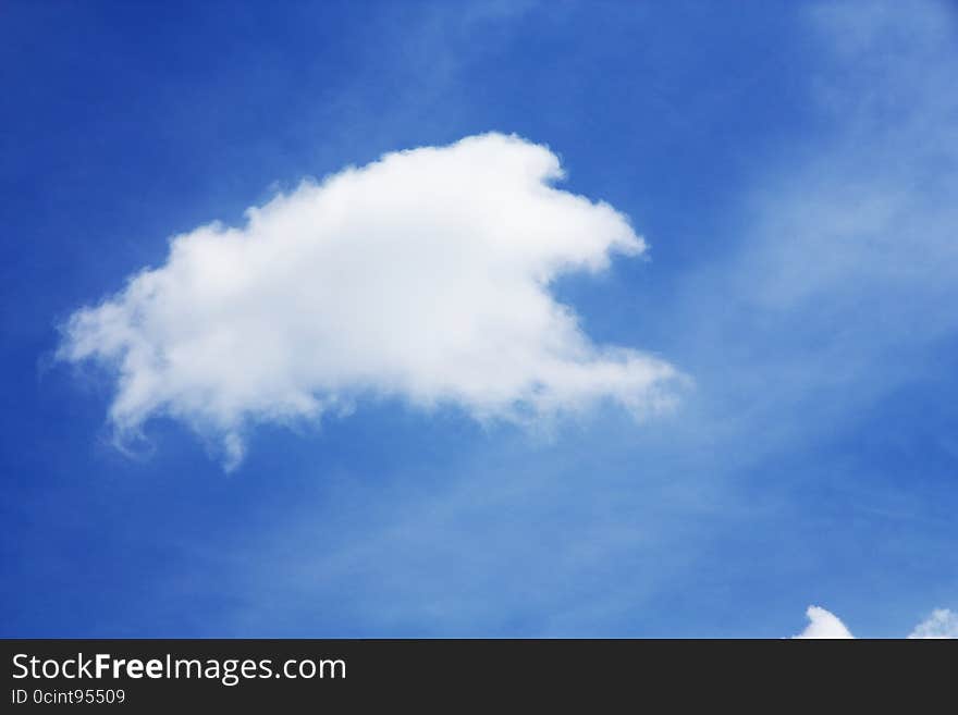 Fluffy white clouds in the blue sky. Fluffy white clouds in the blue sky