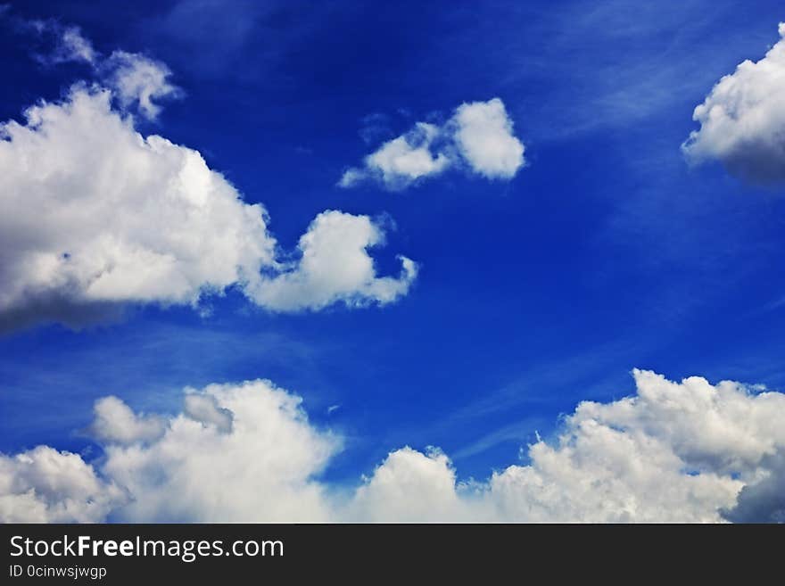 Fluffy white clouds in the blue sky. Fluffy white clouds in the blue sky