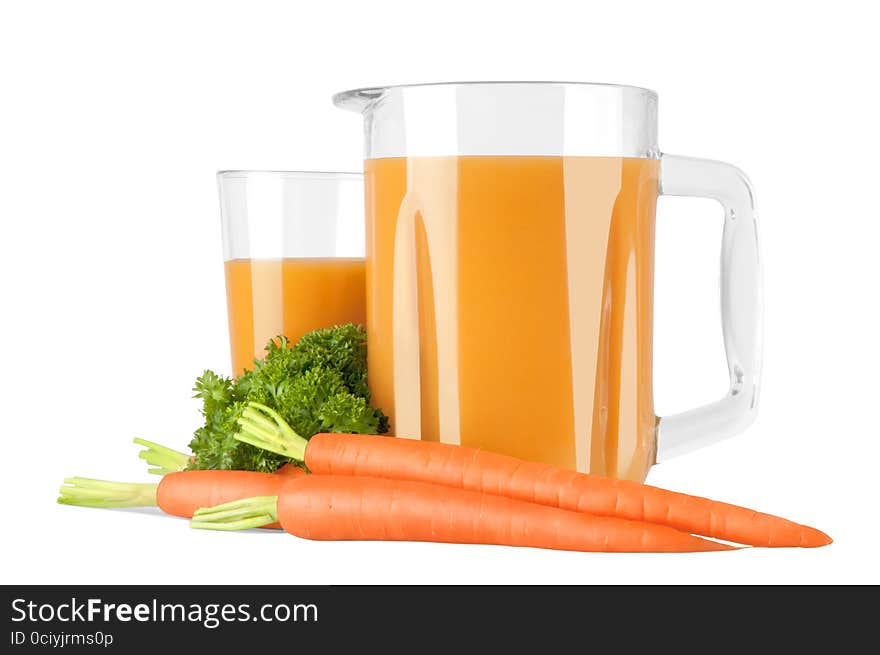 Glass pitcher with carrot juice and carrot. Glass pitcher with carrot juice and carrot