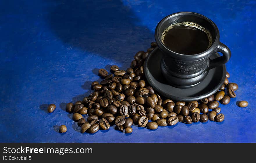 Cup Of Hot Coffee On The Old Blue Background