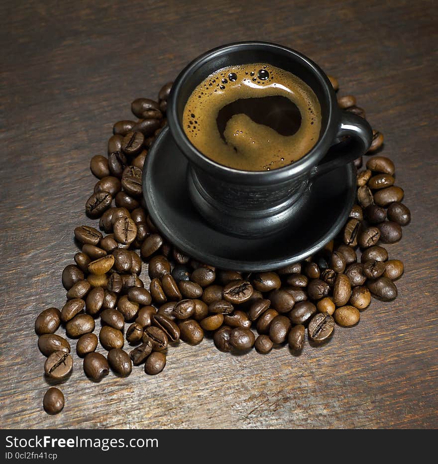 Cup of hot coffee on wooden background