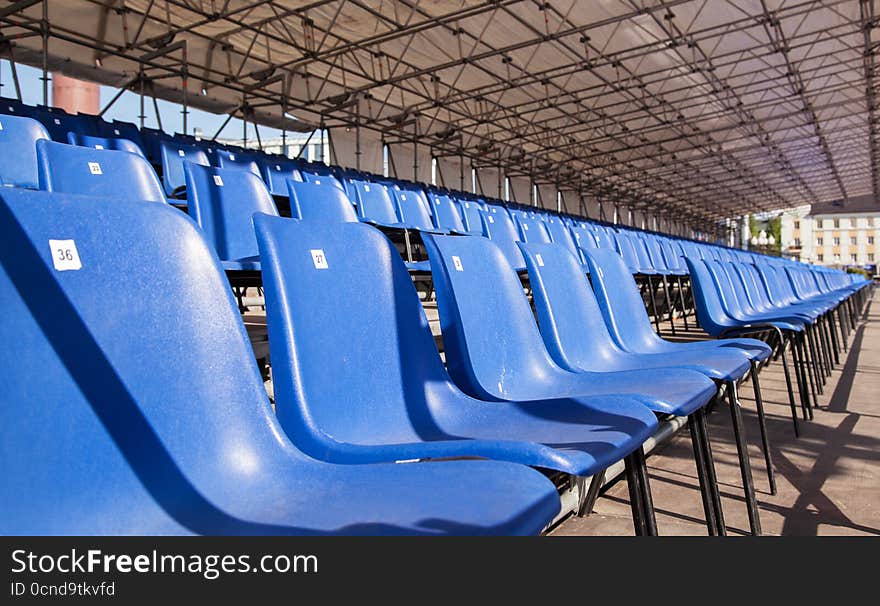 Plastic blue seats in a stadium