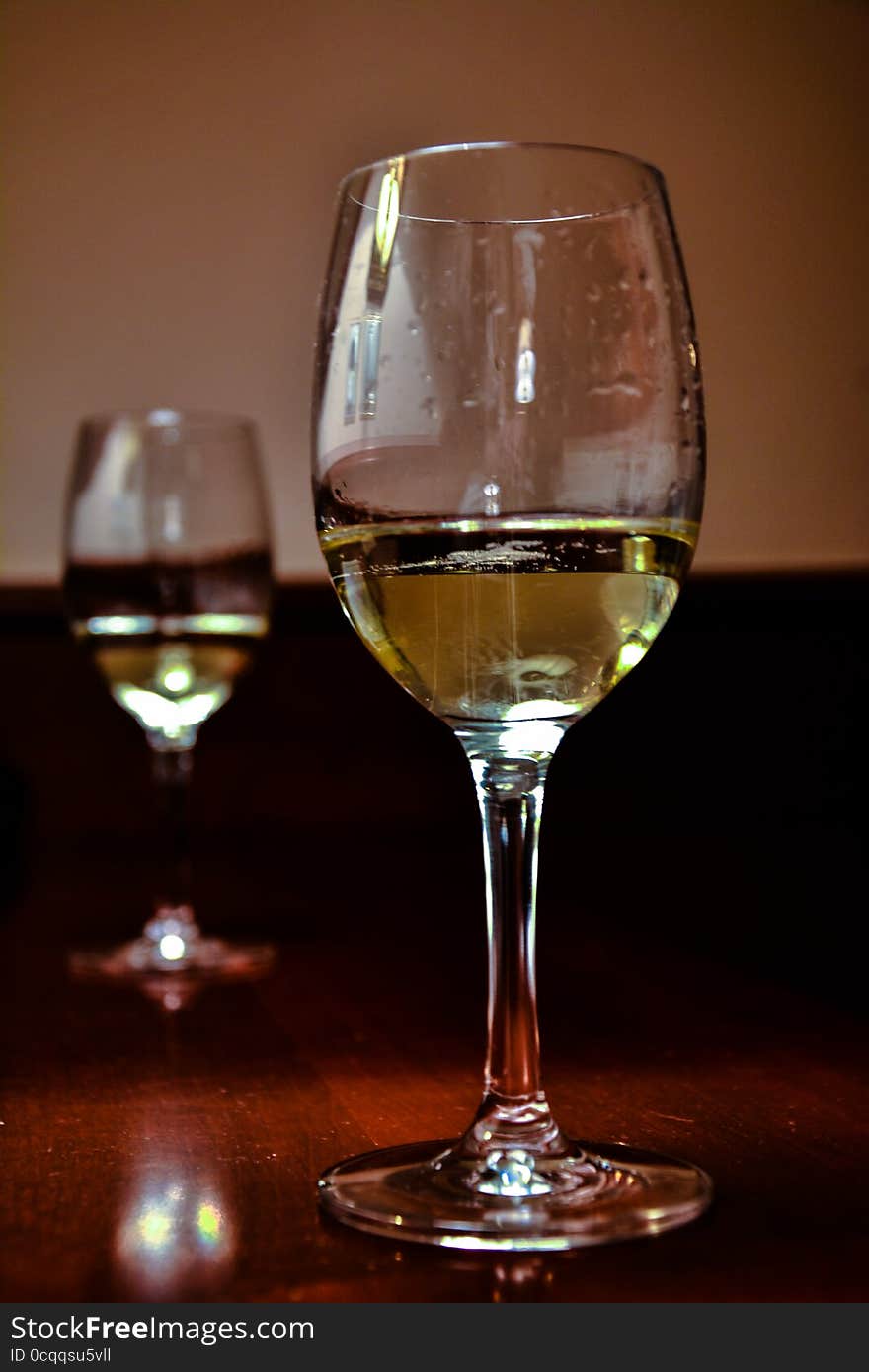 Glasses of white wine, alcohol, the glass. Glasses of white wine, alcohol, the glass