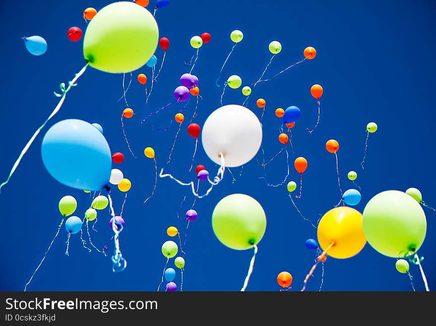 A lot of bright colorful balloons in the sky