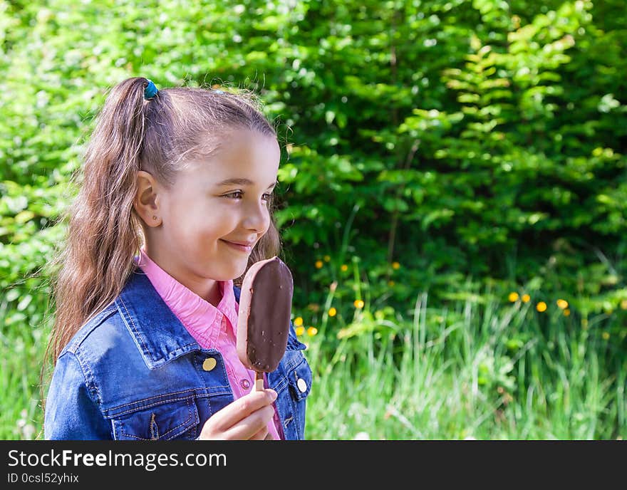 Smiling girl eating ice cream