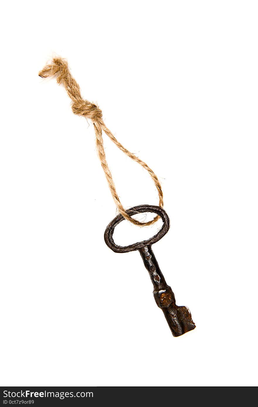 One old key from the door tied with rope