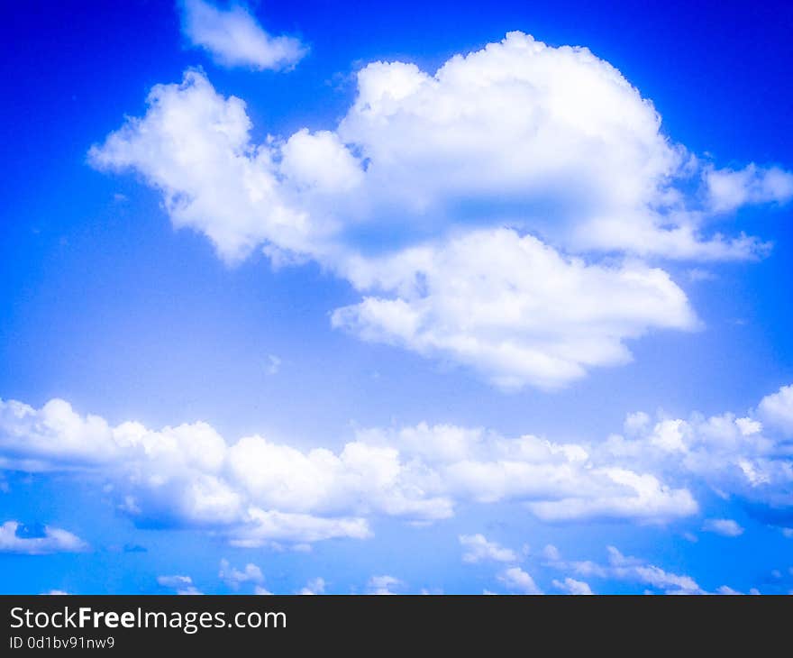 Conceptual picture with sky vision in your dream wit fluffy white clouds in a hot summer day