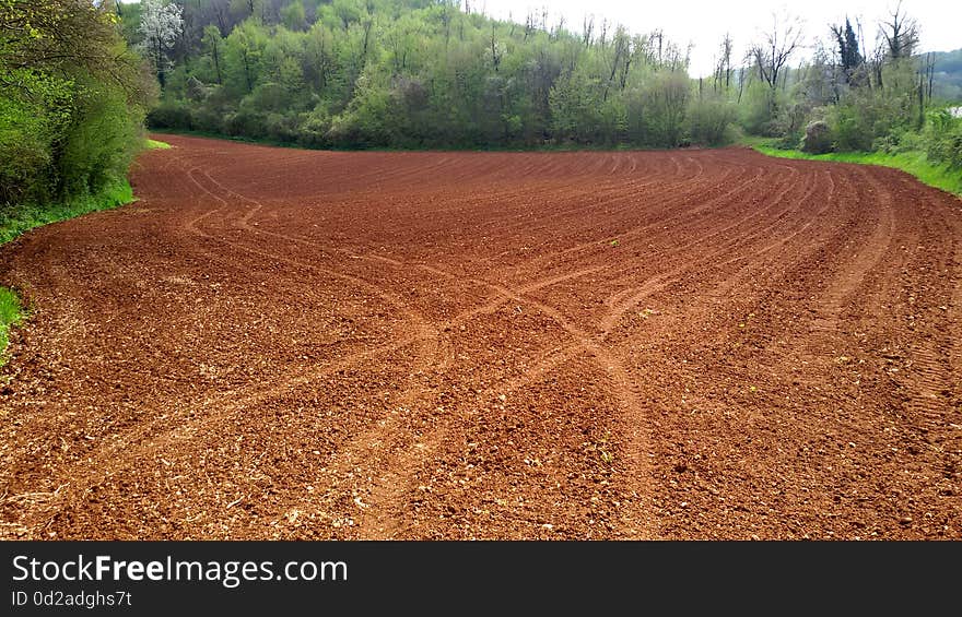 A view of plowed field to the autumn hills of Emilia Romagna, Italy.