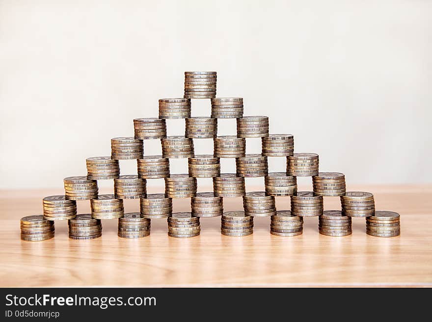 Pyramid of the coins on the table