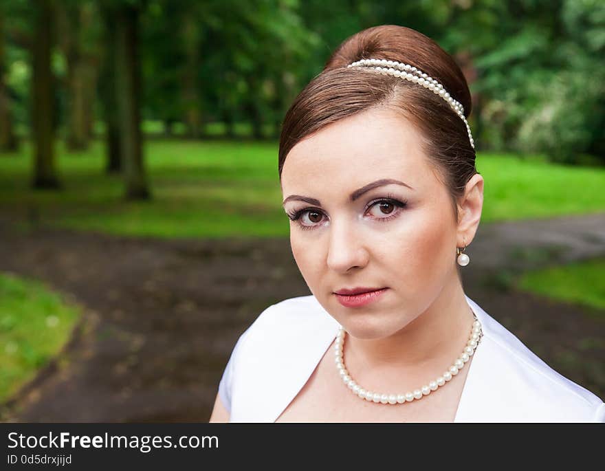 Portrait of a bride in a city park