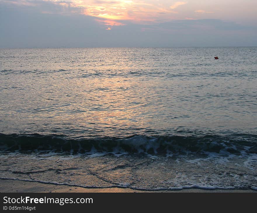 View of the beautiful and calm sea, at sunrise. View of the beautiful and calm sea, at sunrise.