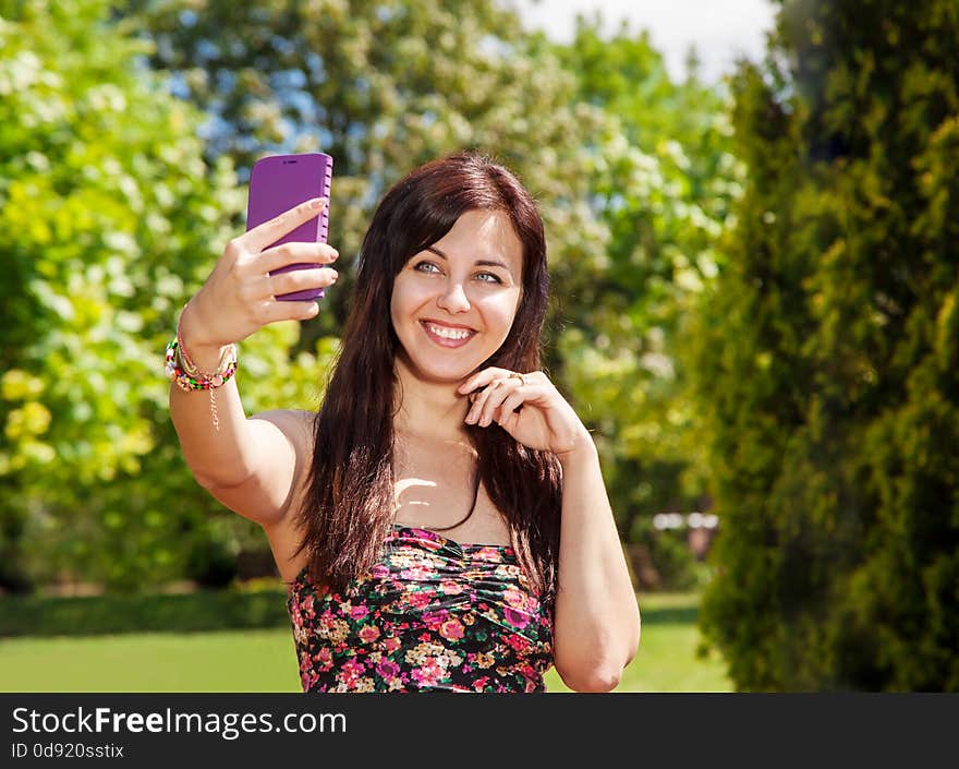 Girl Doing Selfie Mobile Phone In Park