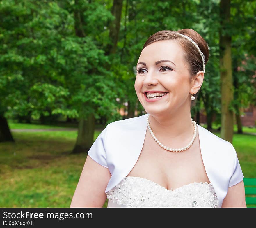 Portrait of a bride in a city park