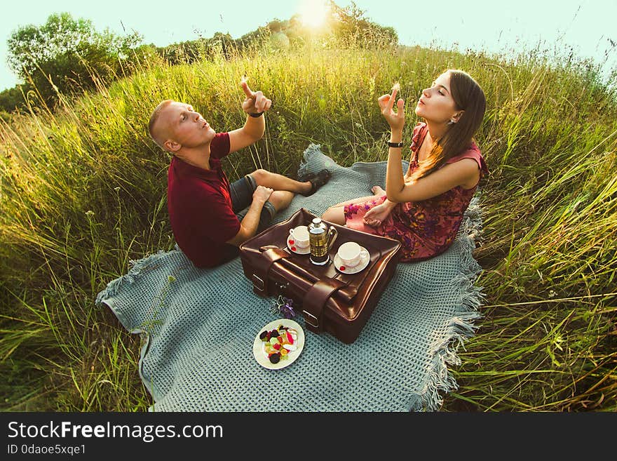 Guy with a girl in summer on the grass