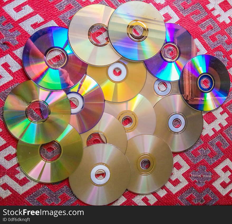 colorful computer compact disks equipment on the table. colorful computer compact disks equipment on the table