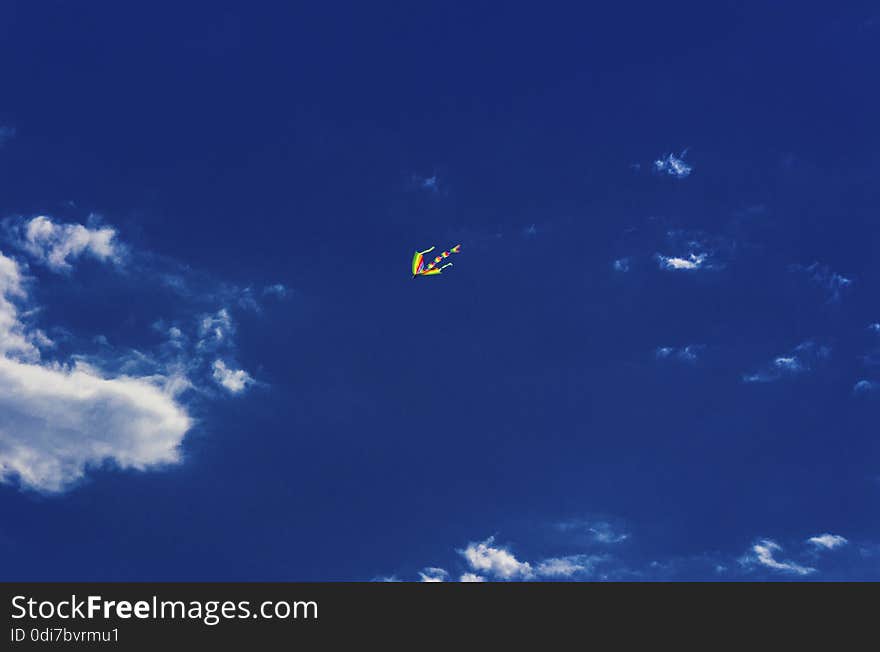 Colorful kite flying in the blue sky. Colorful kite flying in the blue sky