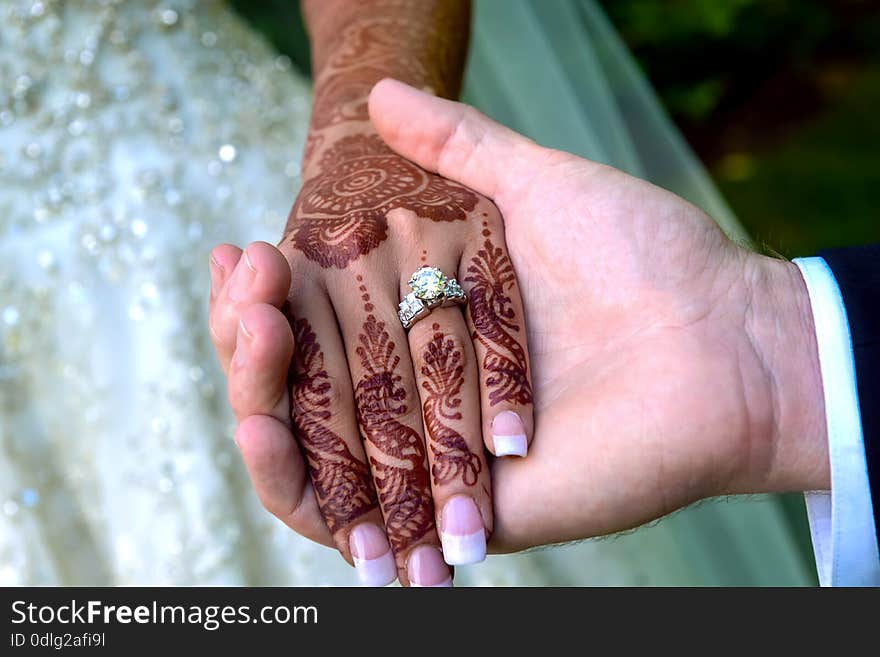 Bride and groom's hands with wedding rings. JUST MERRIED. Bride and groom's hands with wedding rings. JUST MERRIED