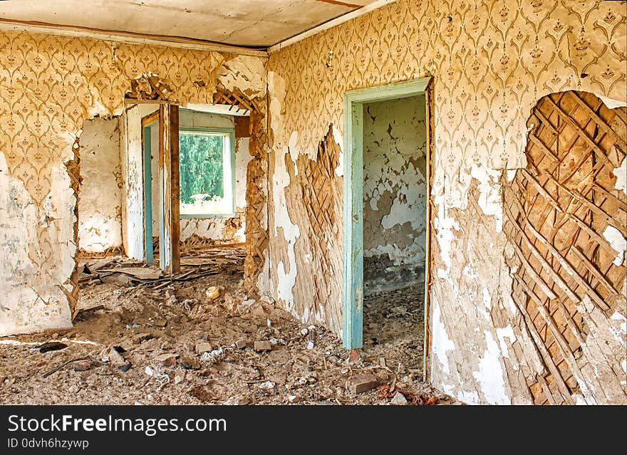 Old abandoned wooden house indoor on sunny summer day