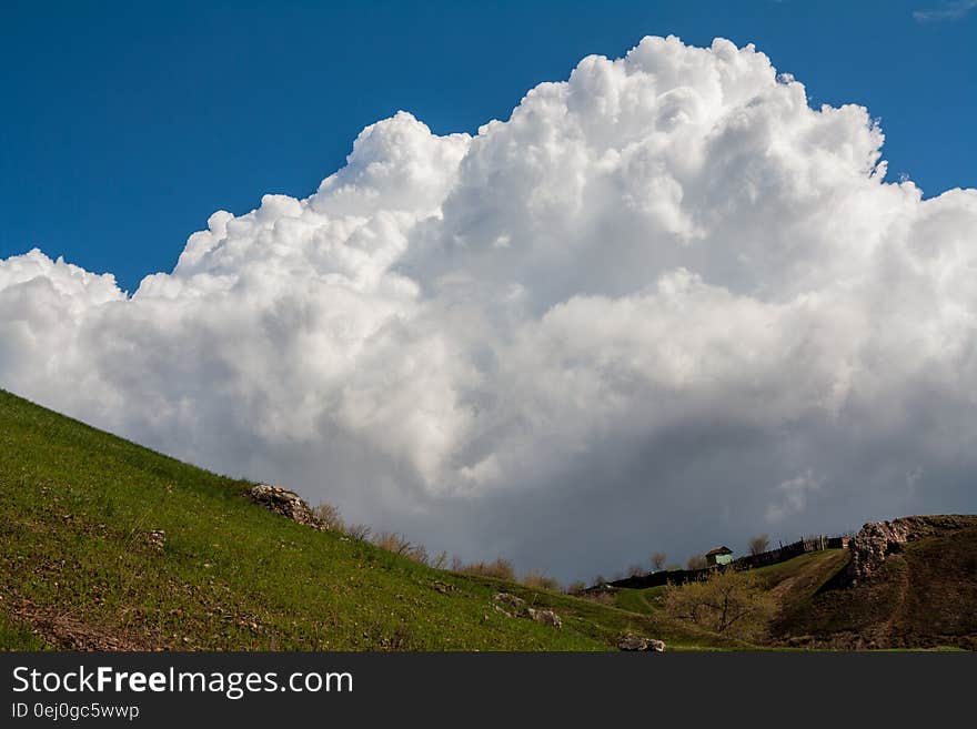 Big cloud over a small house. Big cloud over a small house