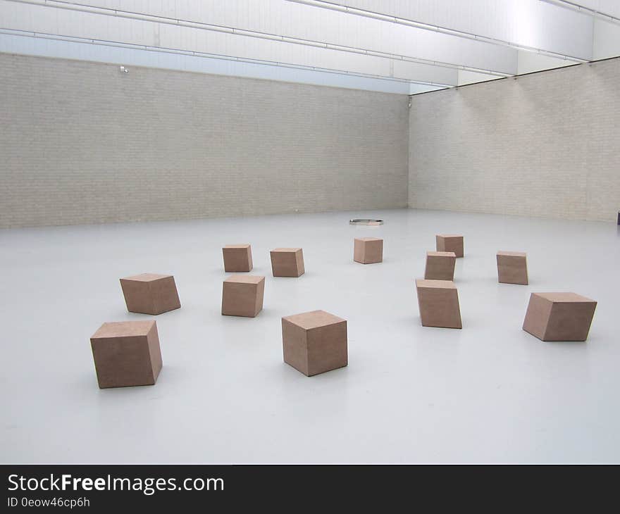 Unmarked plain brown boxes inside empty room. Unmarked plain brown boxes inside empty room.