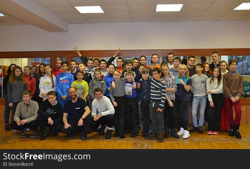 Group of students posing for indoor portrait.