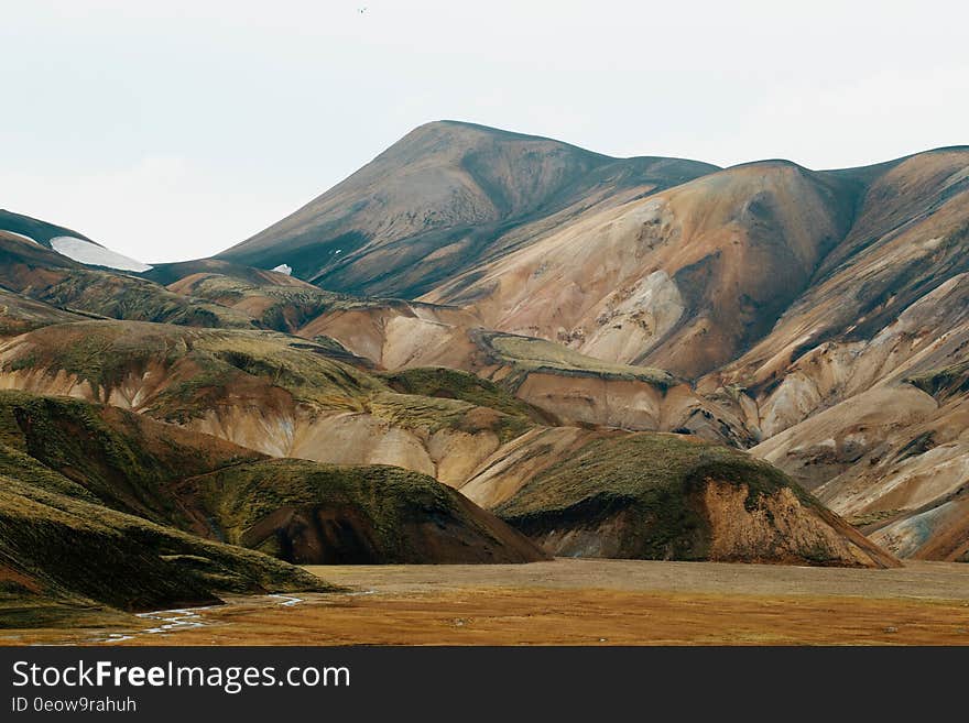 Landscape of rolling hills against grasslands and sunny skies. Landscape of rolling hills against grasslands and sunny skies.