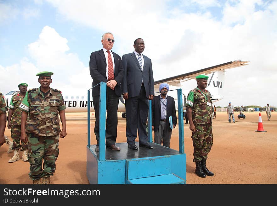 The Special Representative of the UN Secretary-General &#x28;SRSG&#x29; for Somalia, Michael Keating and the Special Representative of the African Union Commission Chairperson &#x28;SRCC&#x29; for Somalia, Ambassador Francisco Caetano Madeira receive a guard of honour from AMISOM troops on arrival at Kismaayo Airport, on November 24, 2016. UN Photo / Barut Mohamed. The Special Representative of the UN Secretary-General &#x28;SRSG&#x29; for Somalia, Michael Keating and the Special Representative of the African Union Commission Chairperson &#x28;SRCC&#x29; for Somalia, Ambassador Francisco Caetano Madeira receive a guard of honour from AMISOM troops on arrival at Kismaayo Airport, on November 24, 2016. UN Photo / Barut Mohamed