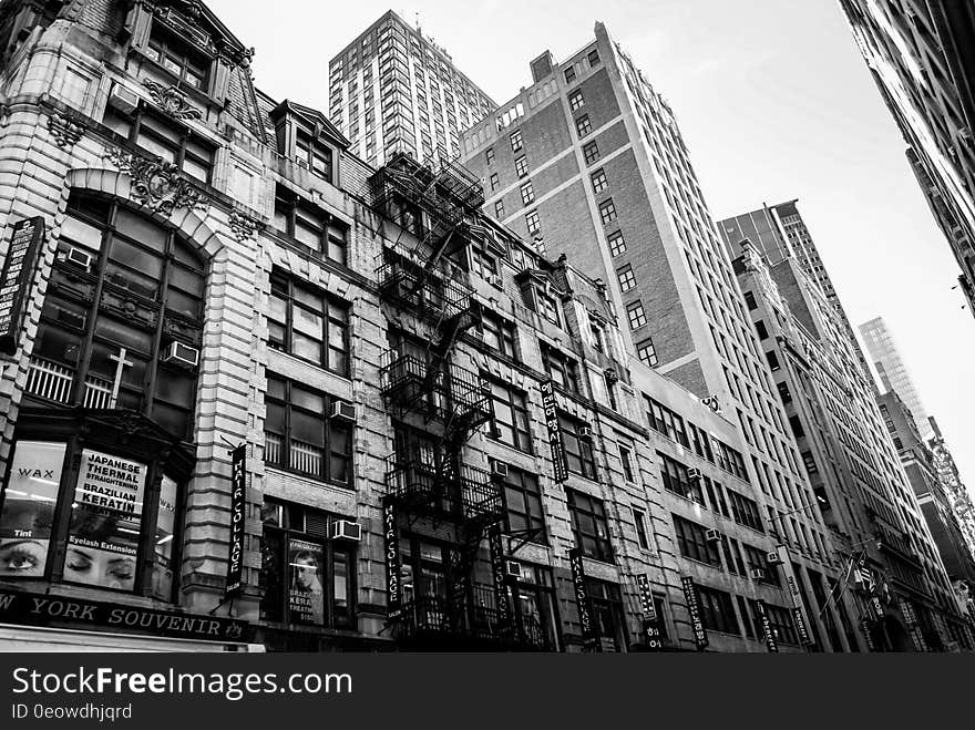 Facade of buildings in urban skyline in daytime in black and white. Facade of buildings in urban skyline in daytime in black and white.