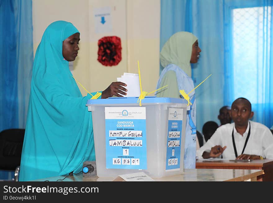 A delegate casts her vote during the electoral process to choose members of the Lower House of the Somali federal Parliament in Baidoa, Somalia on November 23, 2016. AMISOM Photo/ Sabir Olad. A delegate casts her vote during the electoral process to choose members of the Lower House of the Somali federal Parliament in Baidoa, Somalia on November 23, 2016. AMISOM Photo/ Sabir Olad